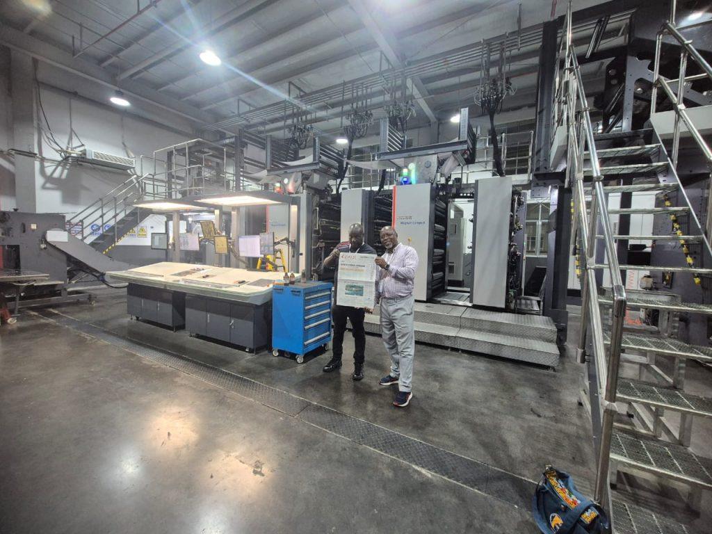 Eric Phiri and Austin Moyo after walikng around and inspecting the latest technology in Newspaper printing in China