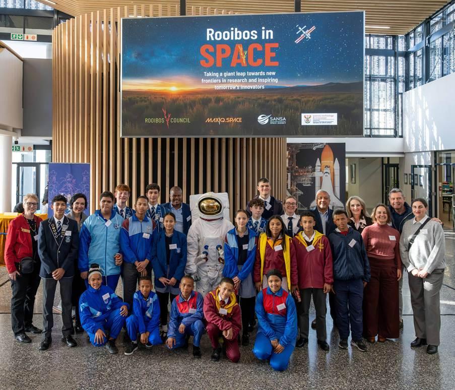 Photo credit: Photographer Patrick King; Apollo 11 astronaut suit courtesy of Annie’s Wardrobe.

 

Caption: Learners from schools in the Cederberg region and Parklands College are pictured with representatives from the South African Rooibos Council (SARC), MaxIQ Space, the South African National Space Agency (SANSA), the Western Cape Education Department at the launch of the Rooibos in Space initiative. The schools will participate in a comparative planting study, growing Rooibos seeds that have travelled to the International Space Station alongside an Earth-based control group to investigate the effects of space on seed germination and plant growth.