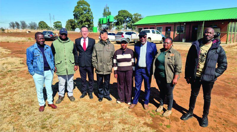 L-R: Dr, Gideon Chitanga, Mr Zhu Liang, Deputy Director of the Press Section (Red Tie), Mr Zhou Bin, First Secretary of the Commercial Section, Mr. Austin Moyo (Navy Suite) with the founding Directors of Optimist Agri Farming during a live tour before the seminar to their piggery